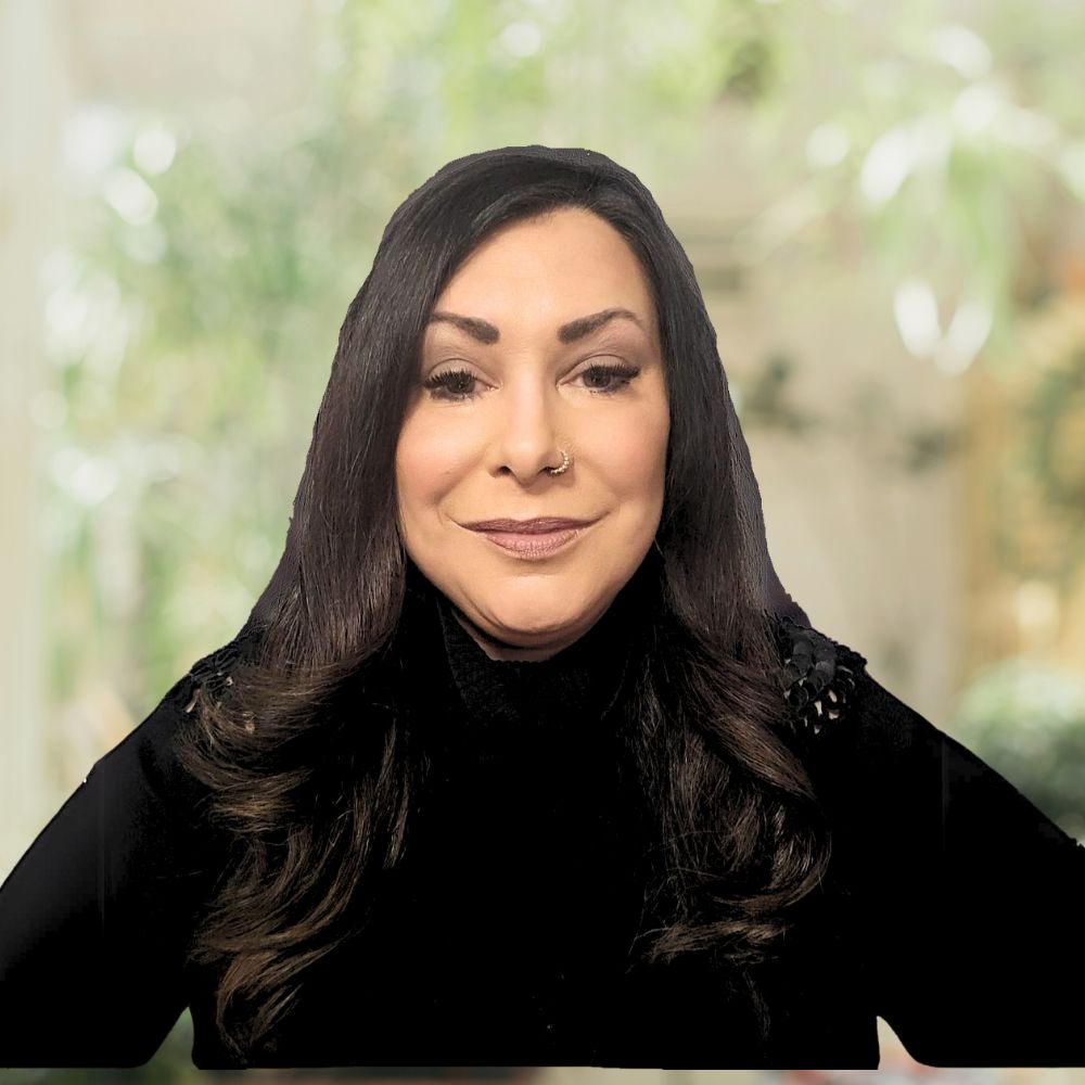 A woman with long dark hair wearing a black top.